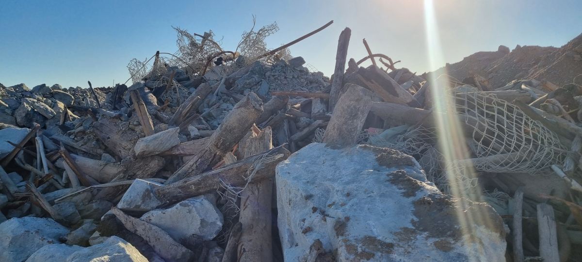 Stockpile of timber, mesh and rock debris from historic surface workings