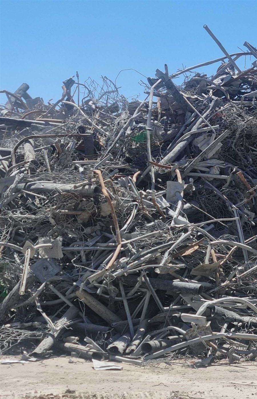 Stockpile of rock bolts, mesh and steel ground-support debris