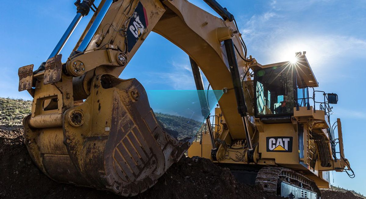 Face shovel bucket with a camera cone-of-vision overlay showing the on-excavator detection zone